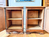 A Pair Of Continental Bedside Cabinets With Marble Tops