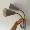 A Pair Of Mid Century Brass Swedish Wall Lights With Pale Lilac Perforated Metal Shades