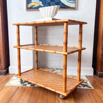 Load image into Gallery viewer, Vintage Faux Bamboo And Cane Console / Shelving Unit On Castors
