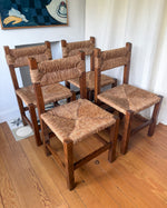Load image into Gallery viewer, Set Of Four French Rustic Dining Chairs With Rush Seats In The Manner Of Charlotte Perriand
