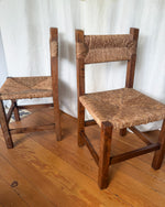 Load image into Gallery viewer, Set Of Four French Rustic Dining Chairs With Rush Seats In The Manner Of Charlotte Perriand
