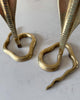 A Pair Of Mid Century Hollywood Regency Brass Cobra Candlesticks