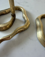 Load image into Gallery viewer, A Pair Of Mid Century Hollywood Regency Brass Cobra Candlesticks
