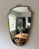 Mid-Century Italian Brass Shield Wall Mirror With Crest In The Style Of Gio Ponti