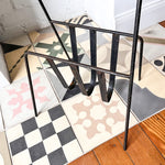 Load image into Gallery viewer, Mid Century Black Iron Magazine Rack With Brass Handle Attributed To Jacques Adnet
