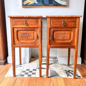 A Pair Of Continental Bedside Cabinets With Marble Tops