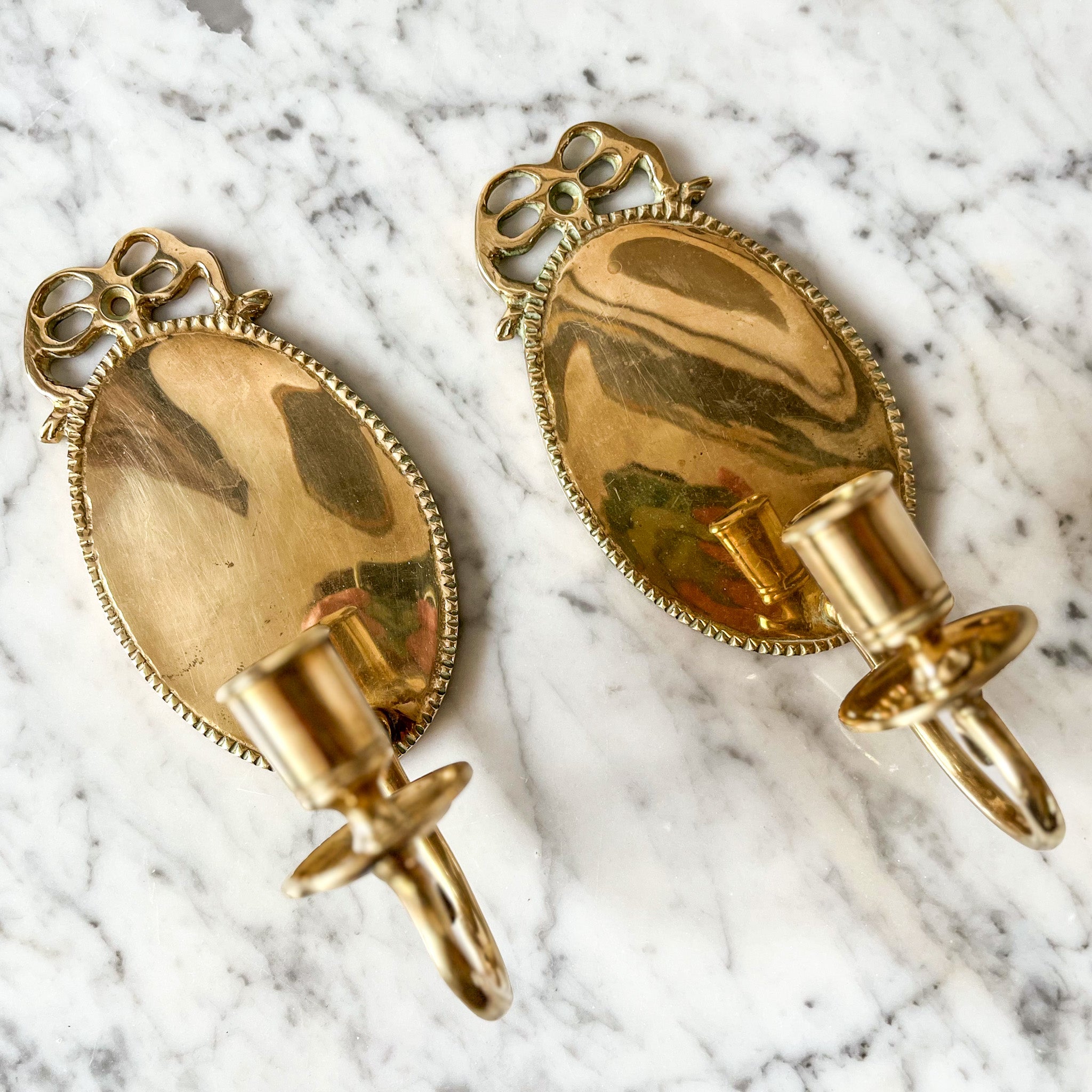 A Pair Of Swedish Brass Bow Candle Sconces